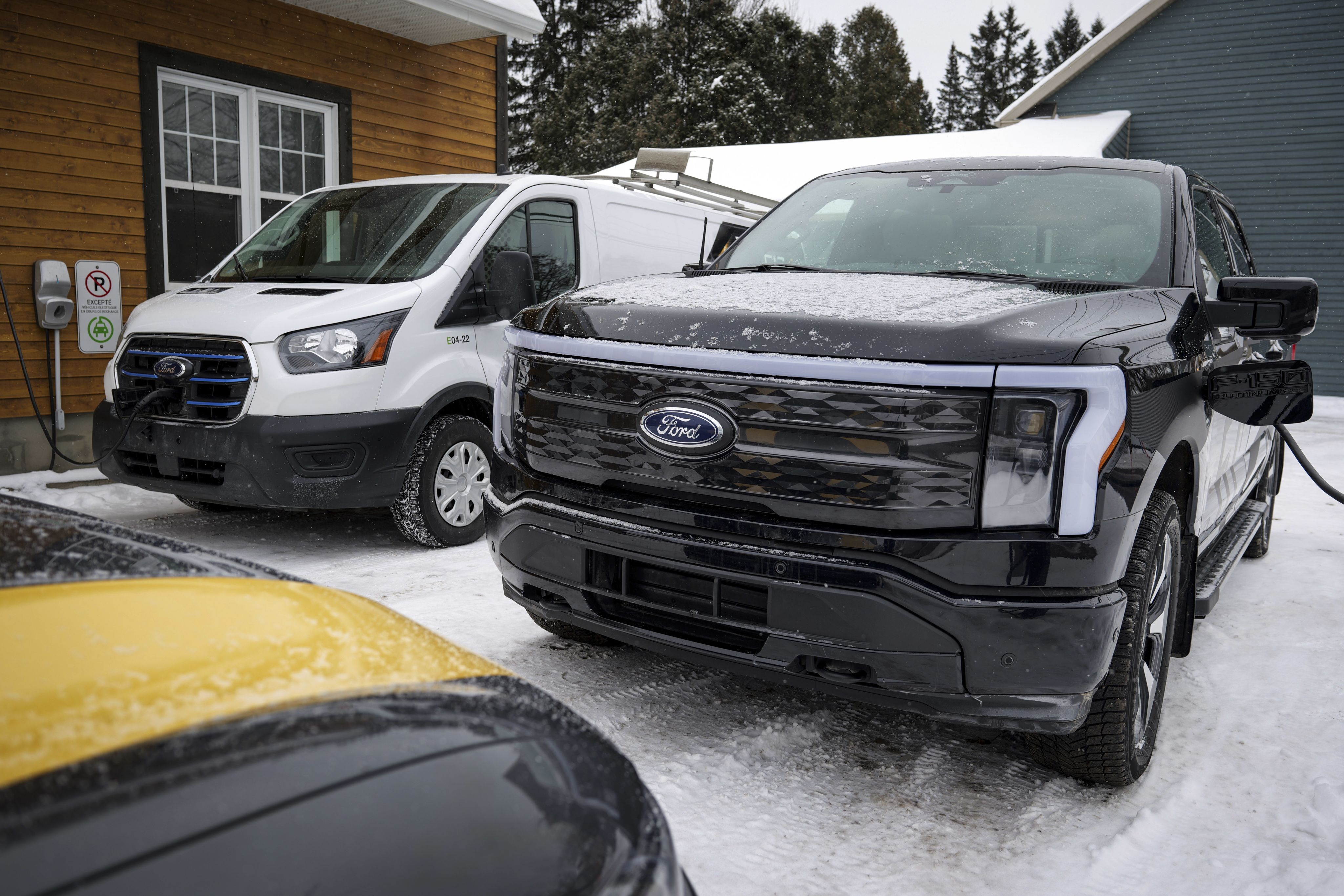 A Canadian business charges an F-150 Lightning and Ford E-Transit that are part of its EV fleet.